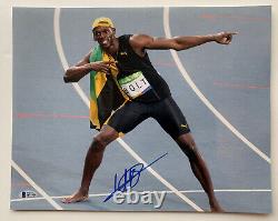 Usain Bolt Autographed 14 x 11 Photo Signed sprinter gold medal Beckett BAS coa