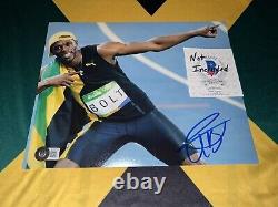 Usain Bolt Signed 8x10 Photo Fastest Man In Earth Jamaican Legend Beckett #23