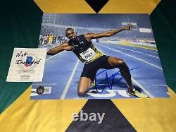 Usain Bolt Signed 8x10 Photo Fastest Man In Earth Jamaican Legend Beckett #31